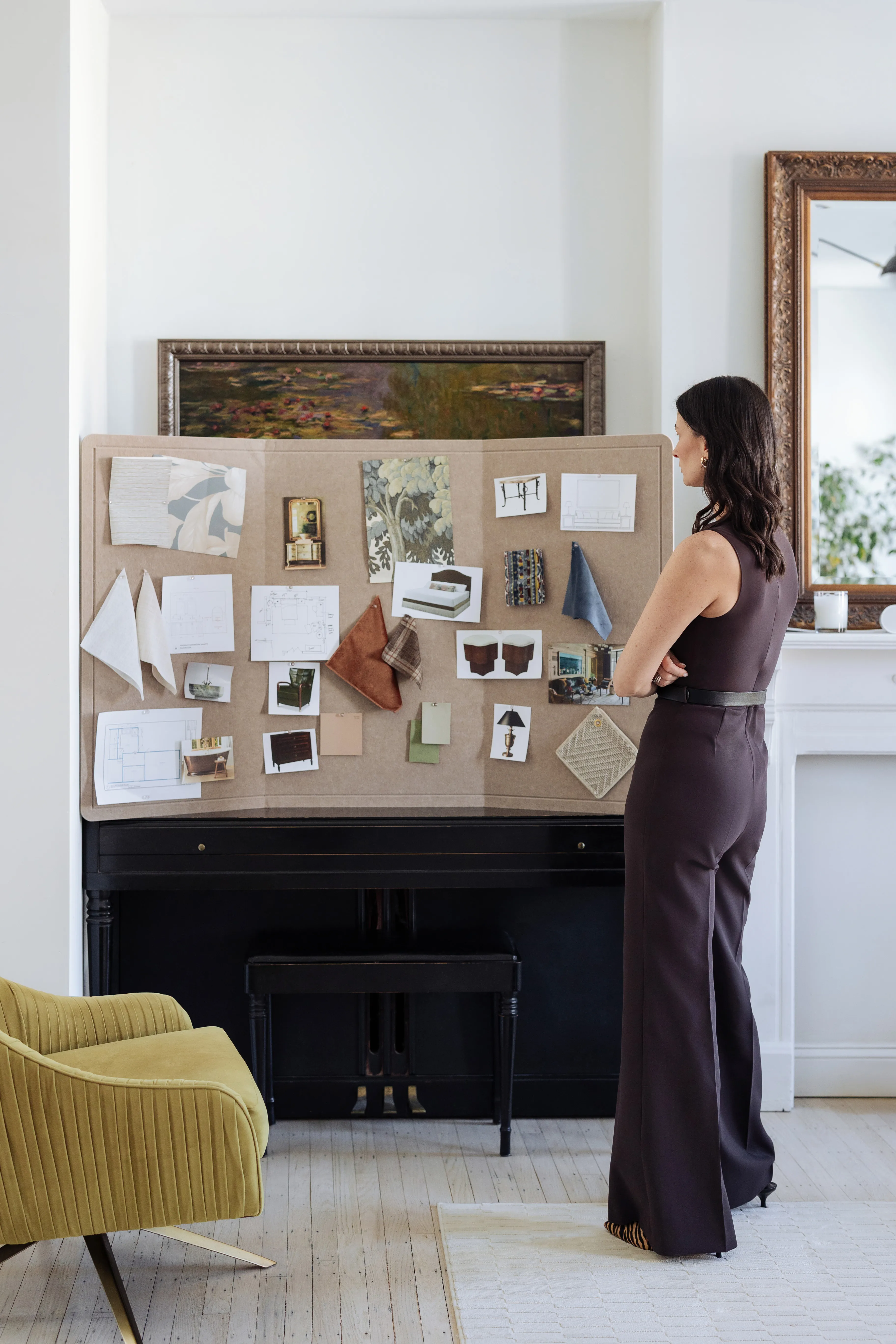 Designer reviewing completed mood board with full design vision