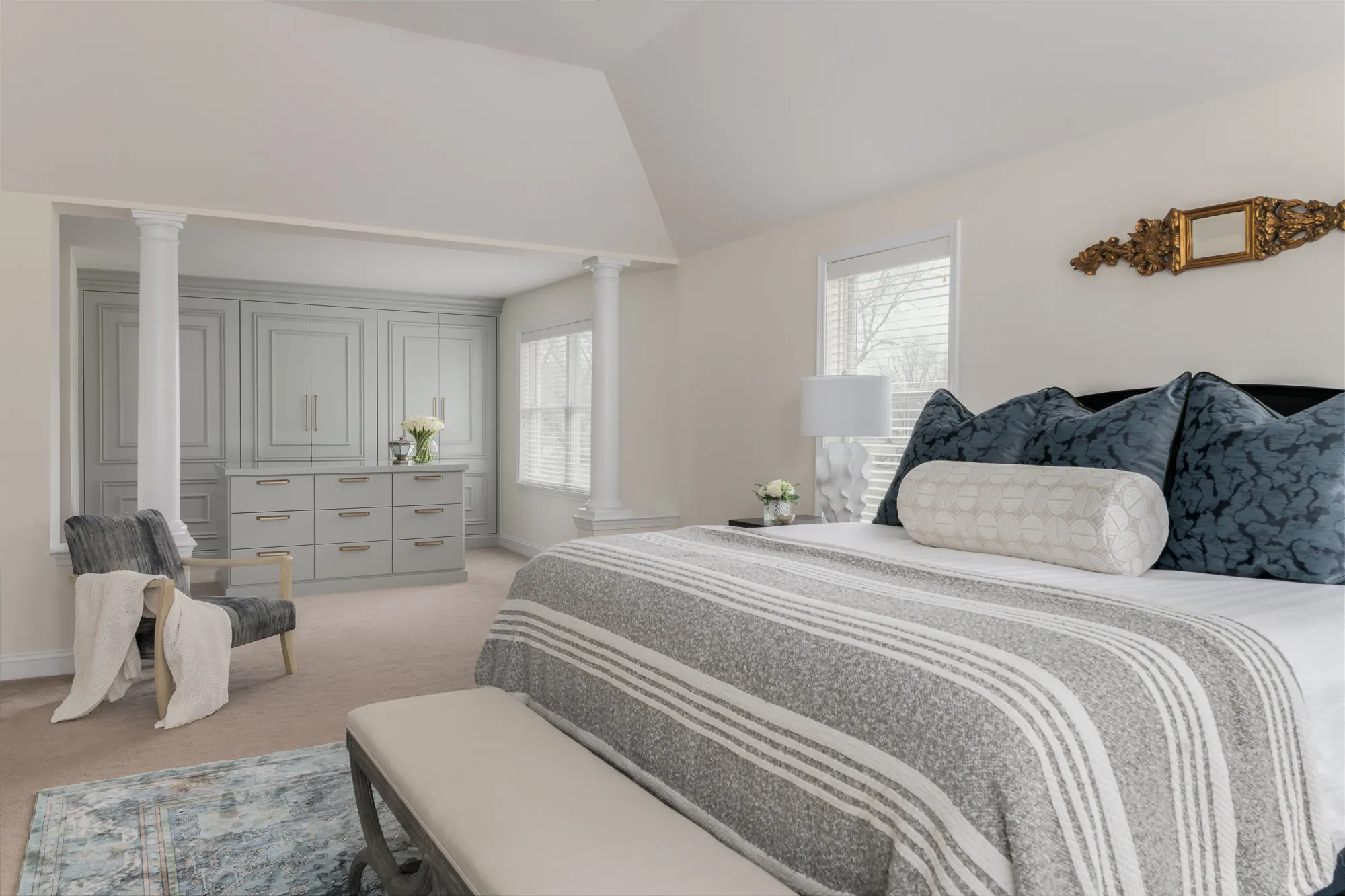 Primary bedroom view toward closet columns and ensuite