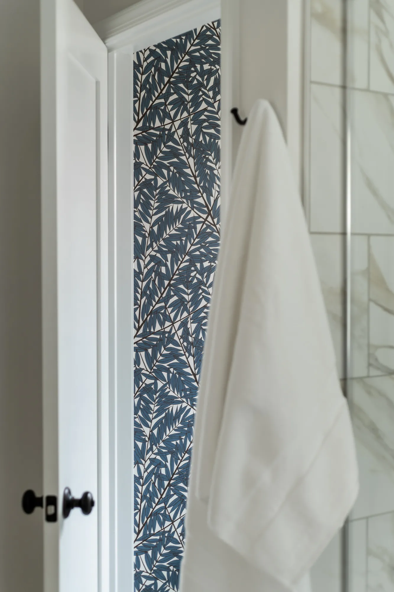 Blue botanical leaf wallpaper accent detail